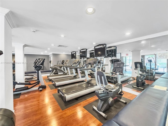 gym featuring recessed lighting, visible vents, crown molding, and wood finished floors