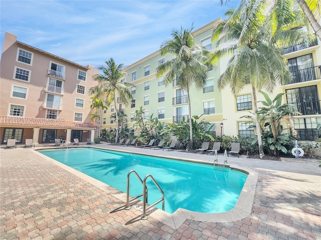 community pool with a patio area