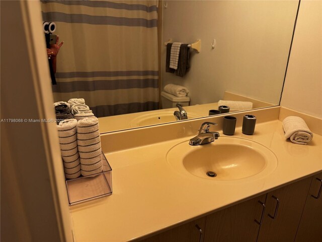 185 SE 14th Ter Unit 1812, Miami, FL 33131 - bathroom with vanity and a shower with shower curtain