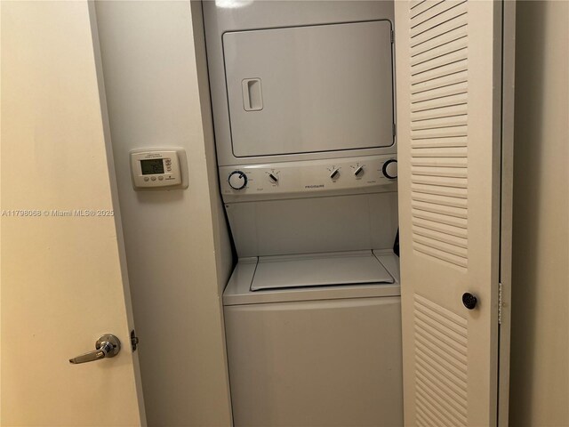 185 SE 14th Ter Unit 1812, Miami, FL 33131 - laundry room featuring estacked washer and dryer
