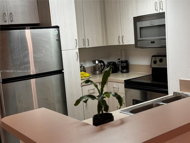 185 SE 14th Ter Unit 1812, Miami, FL 33131 - kitchen with stainless steel appliances, a sink, and light countertops