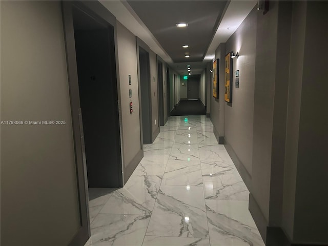 185 SE 14th Ter Unit 1812, Miami, FL 33131 - hallway featuring light marble finish flooring, recessed lighting, and baseboards