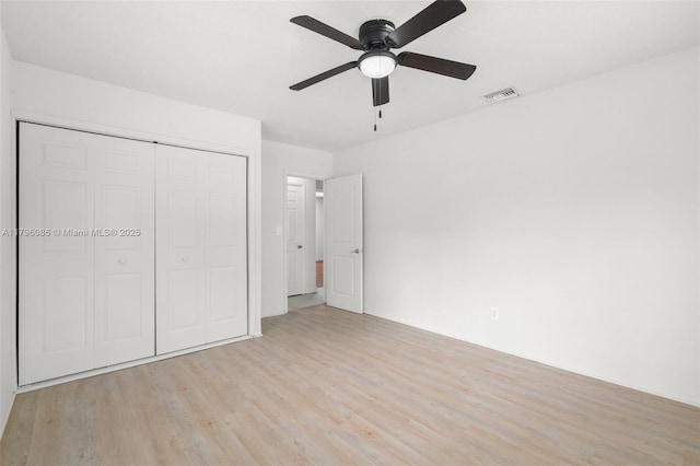 1100 N 31st Ct, Hollywood, FL 33021 - unfurnished bedroom with light wood finished floors, a closet, and ceiling fan