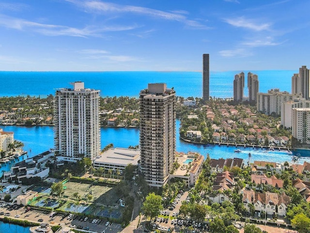 birds eye view of property featuring a water view and a view of city