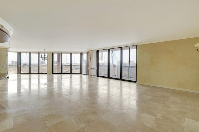 19667 Turnberry Way Unit 16Gr, Aventura, FL 33180 - spare room with floor to ceiling windows, a chandelier, crown molding, baseboards, and light tile patterned floors