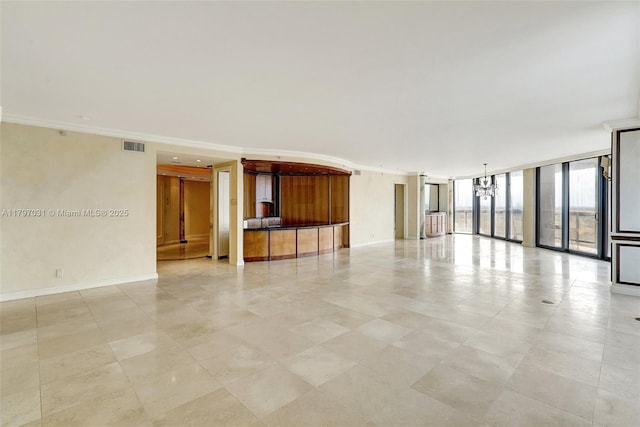 19667 Turnberry Way Unit 16Gr, Aventura, FL 33180 - unfurnished room featuring a chandelier, ornamental molding, expansive windows, and baseboards