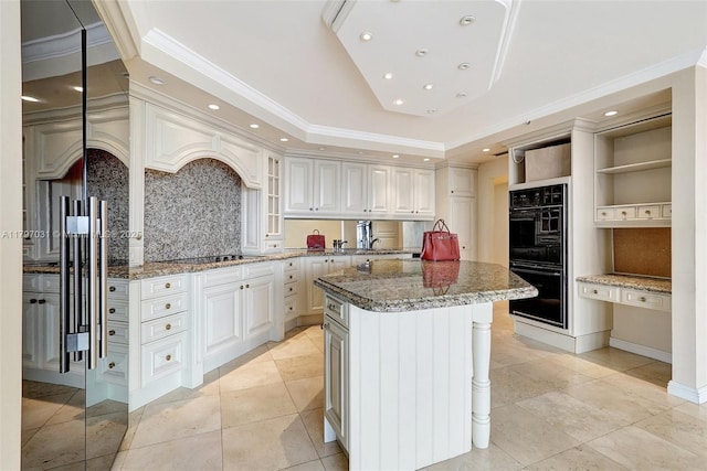 19667 Turnberry Way Unit 16Gr, Aventura, FL 33180 - kitchen featuring black appliances, crown molding, open shelves, tasteful backsplash, and a tray ceiling