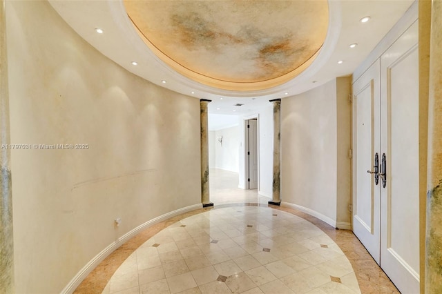 19667 Turnberry Way Unit 16Gr, Aventura, FL 33180 - hallway featuring inlaid floor details, a raised ceiling, recessed lighting, baseboards, and light tile patterned floors