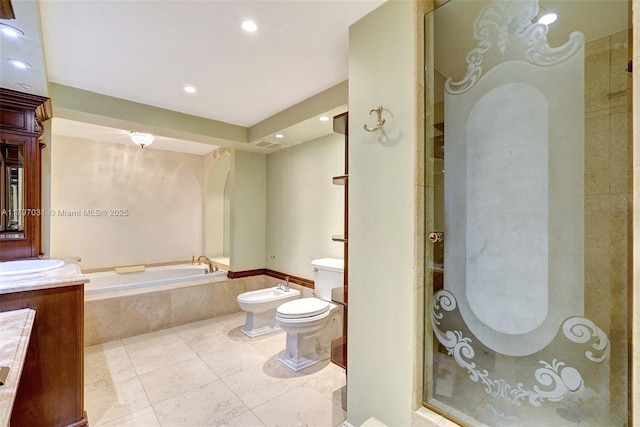 19667 Turnberry Way Unit 16Gr, Aventura, FL 33180 - full bath featuring a bidet, toilet, a garden tub, tile patterned floors, and a stall shower