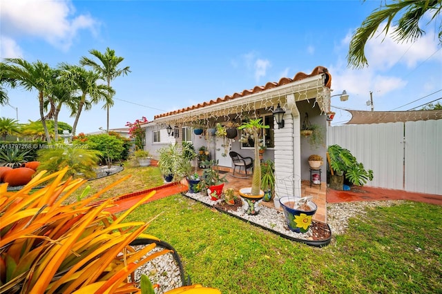 view of yard featuring a patio area and fence