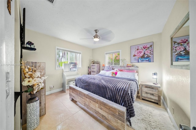 bedroom featuring visible vents, baseboards, and a ceiling fan