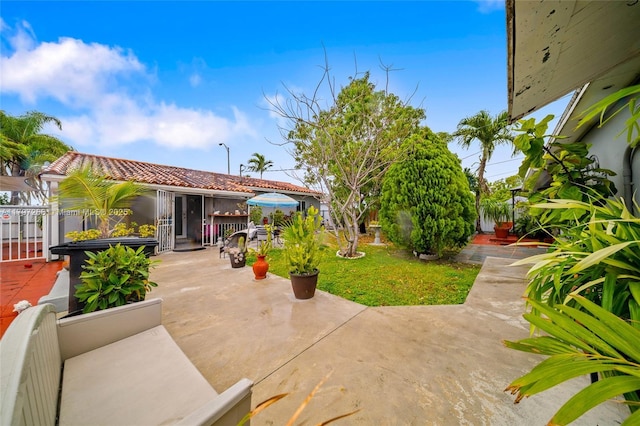 view of patio featuring fence