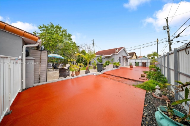 view of yard with a patio area and fence