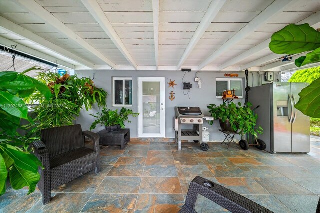 property entrance featuring a patio and stucco siding