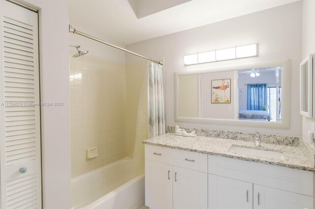 full bath with a closet, vanity, shower / tub combo with curtain, ensuite bath, and a ceiling fan