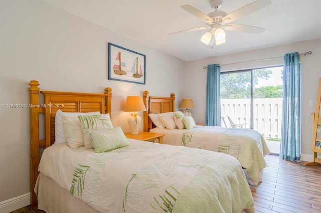 bedroom featuring baseboards, hardwood / wood-style floors, ceiling fan, and access to exterior