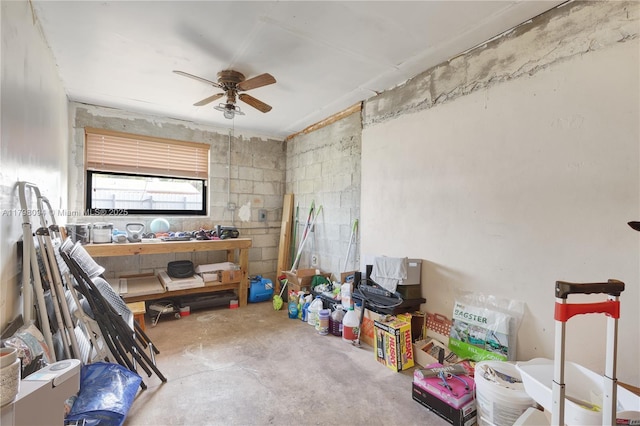 interior space featuring concrete flooring and a ceiling fan
