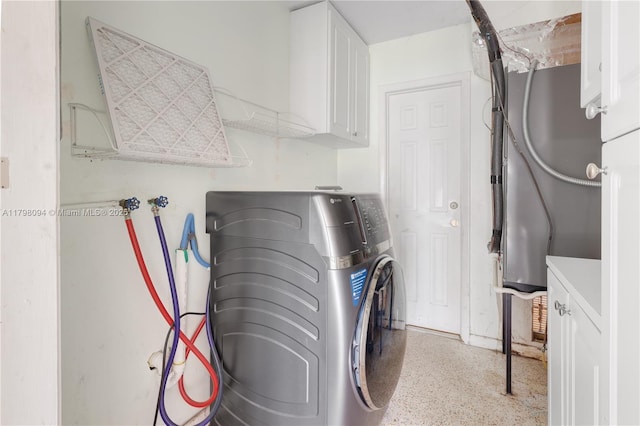 laundry room featuring cabinet space and washing machine and clothes dryer