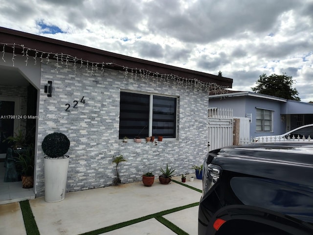 224 E 42nd St, Hialeah, FL 33013 - view of home's exterior with a patio