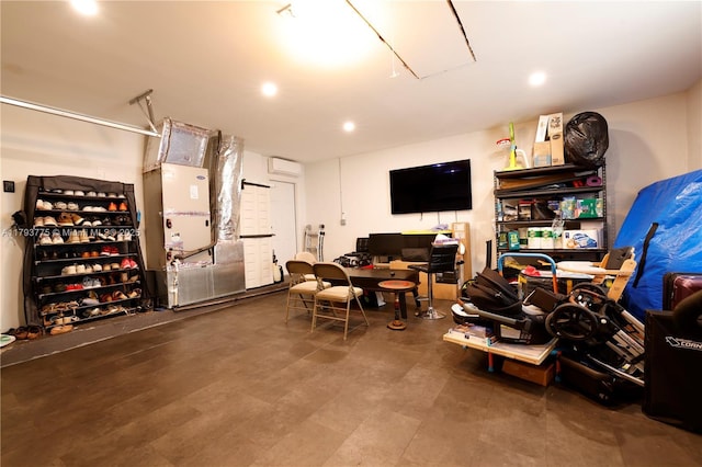 basement featuring recessed lighting, a wall mounted AC, and heating unit