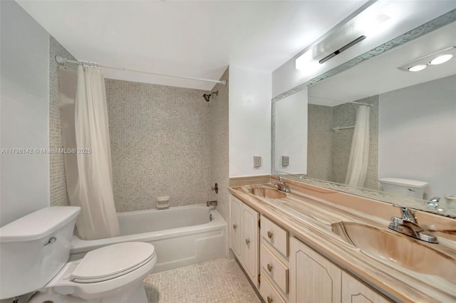 bathroom featuring a sink, double vanity, toilet, and shower / tub combo