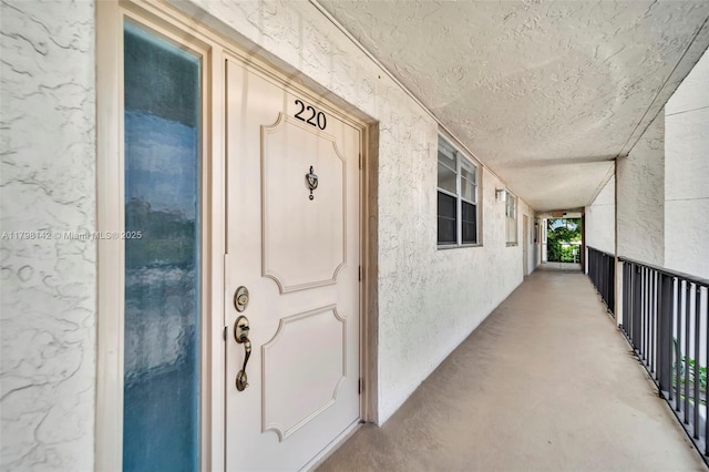 doorway to property with stucco siding