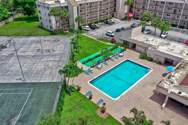 view of pool featuring a yard