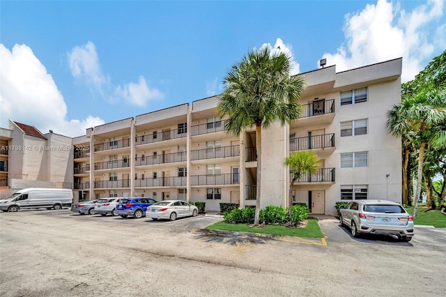 view of property with uncovered parking