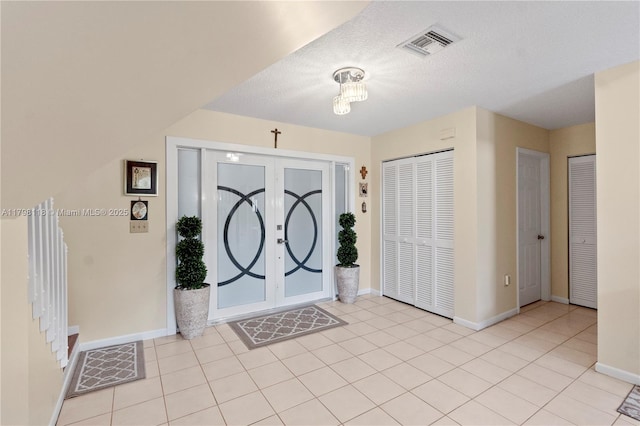 631 NW 205th Ave, Pembroke Pines, FL 33029 - foyer entrance featuring french doors, light tile patterned floors, visible vents, and baseboards