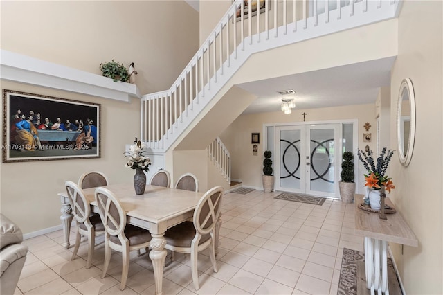 631 NW 205th Ave, Pembroke Pines, FL 33029 - dining room with light tile patterned floors, stairway, a towering ceiling, and visible vents