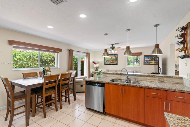 631 NW 205th Ave, Pembroke Pines, FL 33029 - kitchen featuring light stone countertops, stainless steel dishwasher, visible vents, and a sink