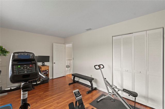 631 NW 205th Ave, Pembroke Pines, FL 33029 - exercise area featuring visible vents, wood finished floors, and baseboards