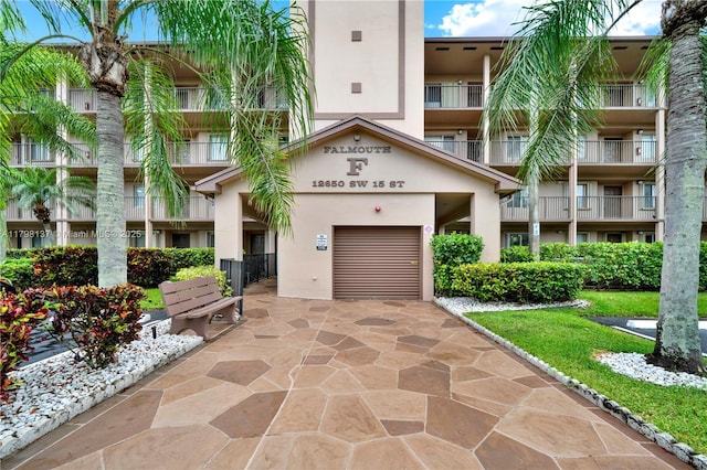 view of building exterior with driveway
