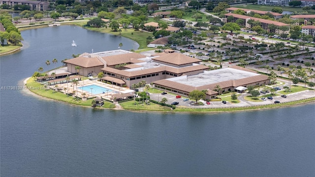 bird's eye view of a nearby body of water and a pool