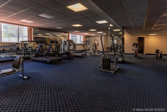 workout area featuring a drop ceiling