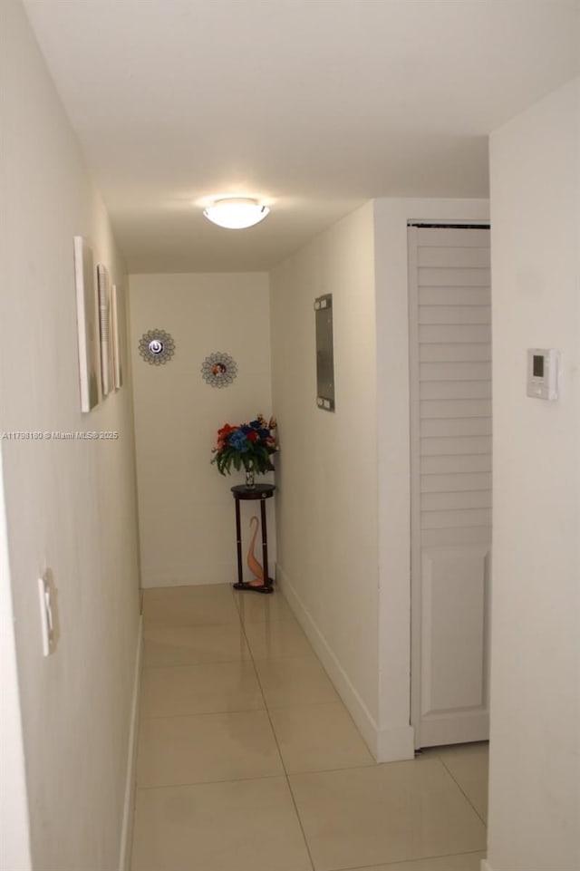 1221 SW 122nd Ave Unit 401, Miami, FL 33184 - hall featuring light tile patterned floors and baseboards