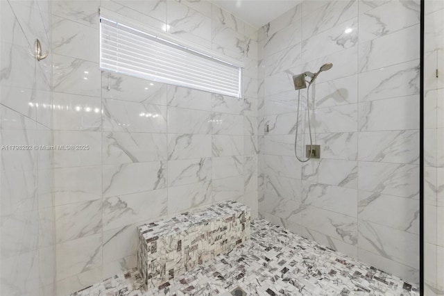 full bathroom with tiled shower