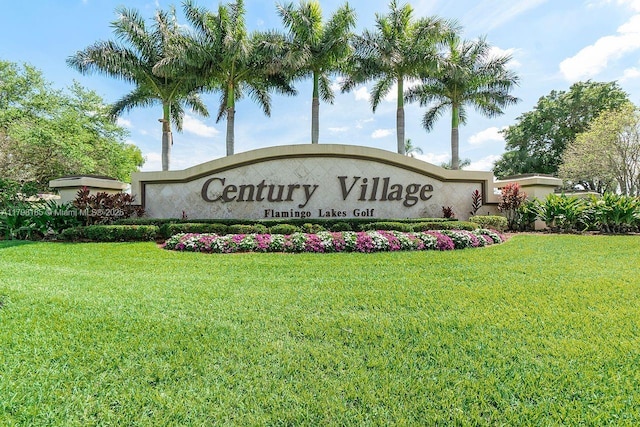 1401 SW 128th Ter Unit 305H, Pembroke Pines, FL 33027 - community / neighborhood sign featuring a lawn