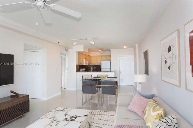 2665 SW 37th Ave Unit 1506, Miami, FL 33133 - living area with ceiling fan, light tile patterned floors, and crown molding