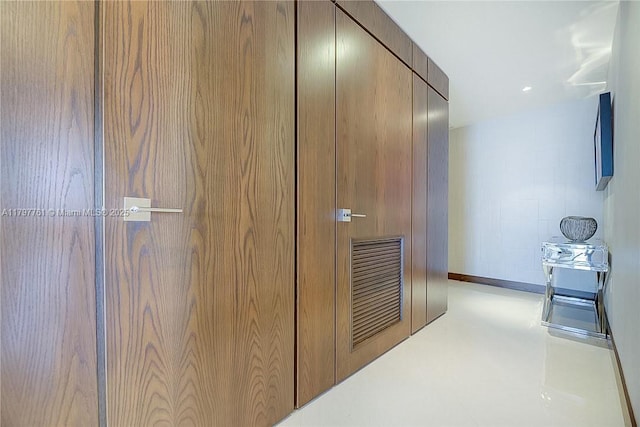 corridor with baseboards and recessed lighting