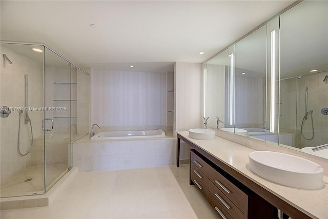 full bath featuring a garden tub, a shower stall, double vanity, and recessed lighting