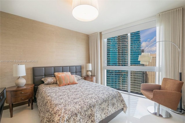 bedroom featuring expansive windows