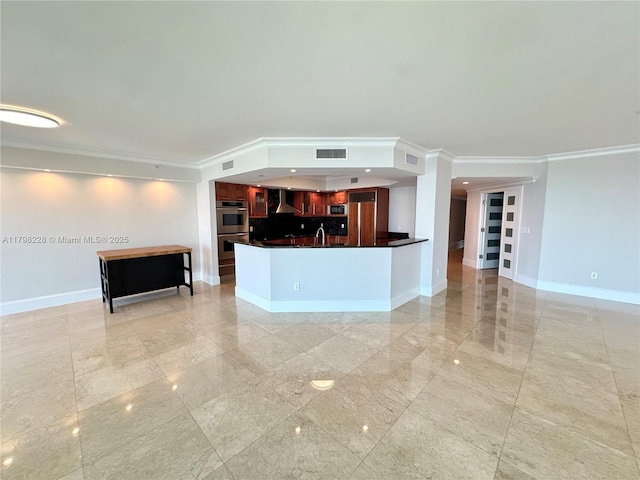 unfurnished living room with crown molding, visible vents, baseboards, and a sink