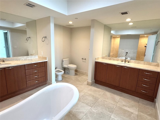 bathroom with a bidet, a bath, visible vents, and a sink