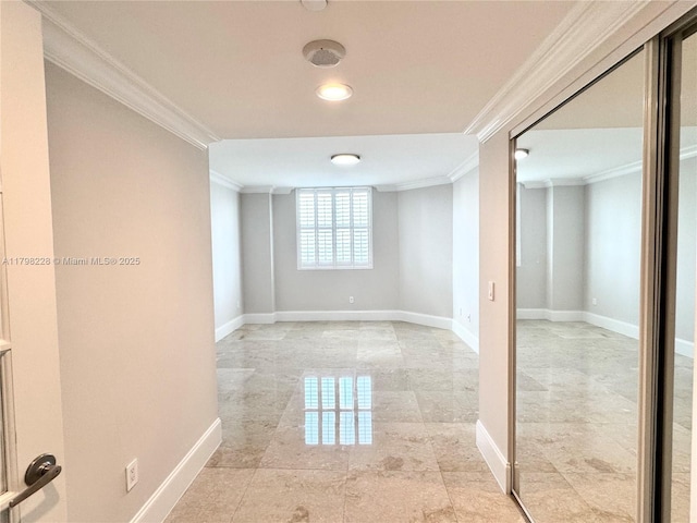 below grade area featuring baseboards and crown molding