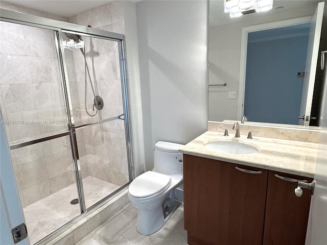 full bath with tile patterned floors, a stall shower, toilet, and vanity