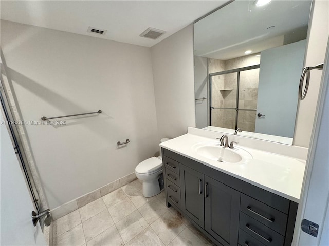 bathroom featuring a stall shower, vanity, toilet, and visible vents