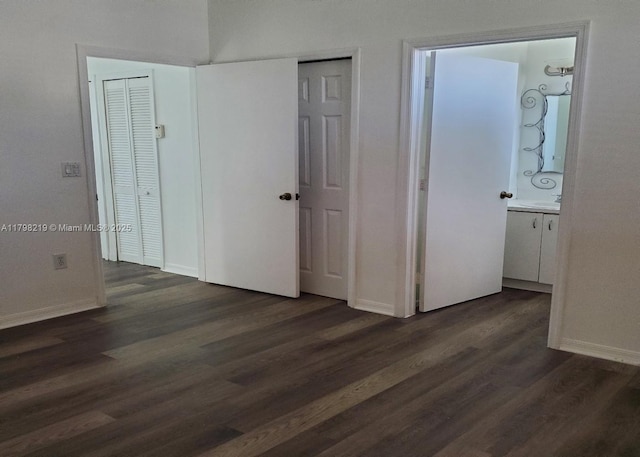 6101 NW 114th Ct Unit 124, Doral, FL 33178 - unfurnished bedroom featuring dark wood finished floors and baseboards