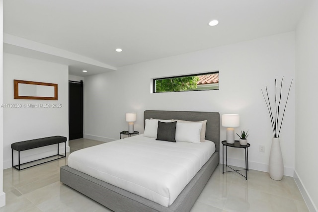 231 NE 45th St, Miami, FL 33137 - bedroom featuring light tile patterned flooring, a barn door, baseboards, and recessed lighting