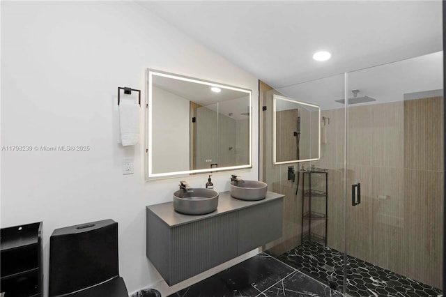 231 NE 45th St, Miami, FL 33137 - bathroom featuring double vanity, marble finish floor, a stall shower, and a sink